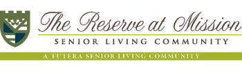 Logo for The Reserve at Mission Senior Living Community, featuring a stylized shield on the left and elegant text. Below, it reads: 