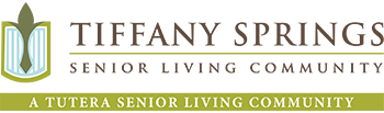 Logo of Tiffany Springs Senior Living, a Senior Living Community. The logo features a stylized shield with a green leaf and a ribbon, accompanied by the center’s name in elegant font.